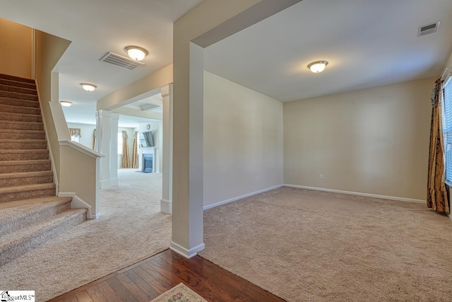 empty room with hardwood / wood-style floors