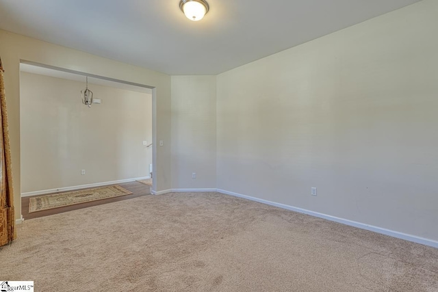 spare room with light colored carpet