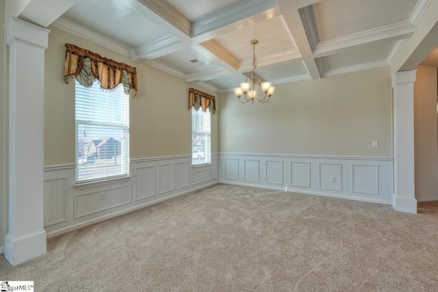 spare room featuring beam ceiling, light colored carpet, ornamental molding, and coffered ceiling