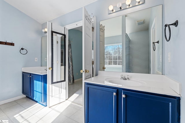 bathroom with vanity and tile patterned floors