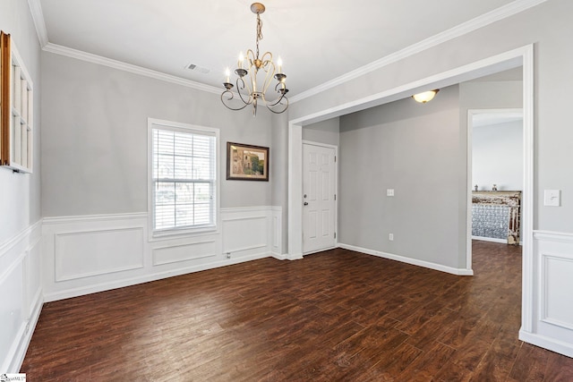 unfurnished dining area featuring crown molding, dark hardwood / wood-style floors, and a notable chandelier