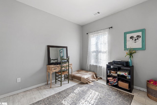 sitting room with light hardwood / wood-style flooring