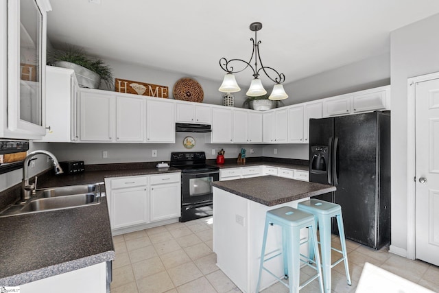 kitchen featuring black appliances, white cabinets, sink, decorative light fixtures, and a kitchen island