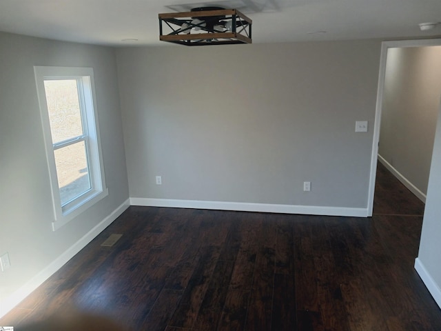 unfurnished dining area with plenty of natural light and dark hardwood / wood-style flooring