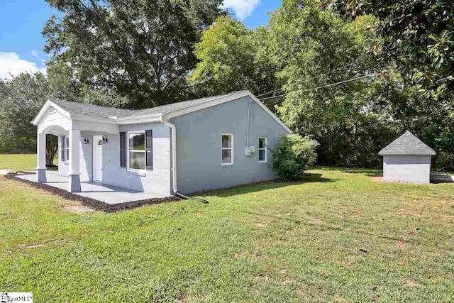 view of property exterior with a yard