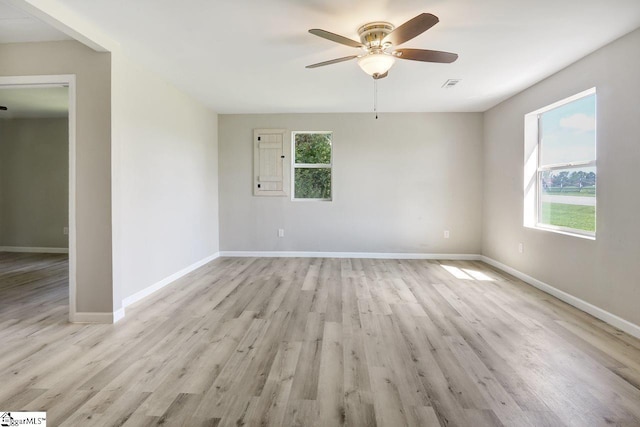 unfurnished room with ceiling fan and light hardwood / wood-style flooring