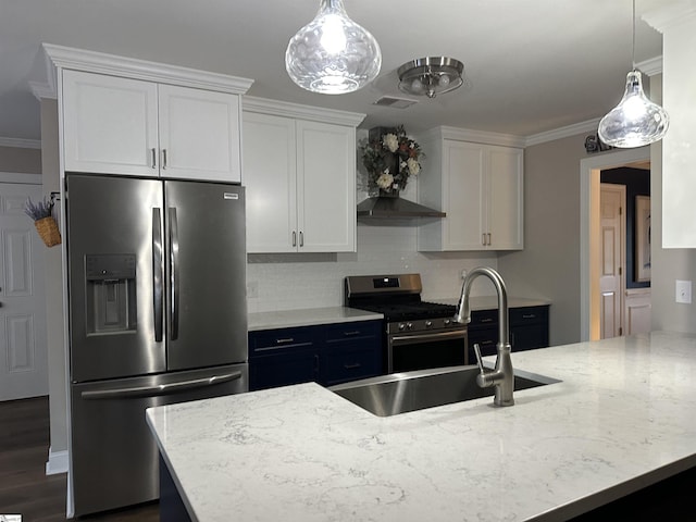 kitchen featuring backsplash, light stone counters, white cabinets, and stainless steel appliances