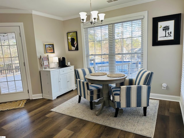 dining room with dark hardwood / wood-style flooring, crown molding, and a notable chandelier