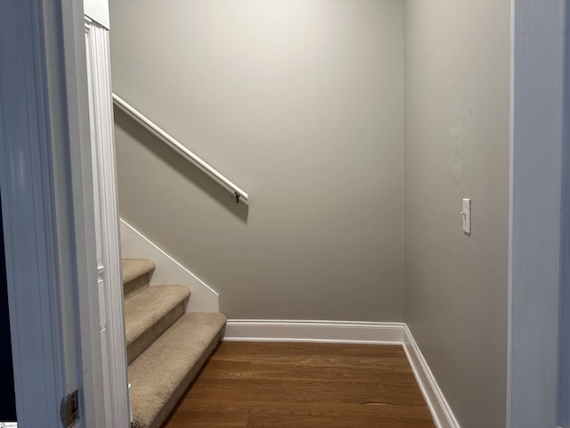 stairway featuring hardwood / wood-style flooring