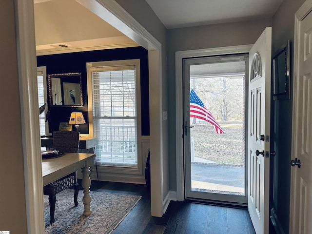 doorway to outside with dark wood-type flooring