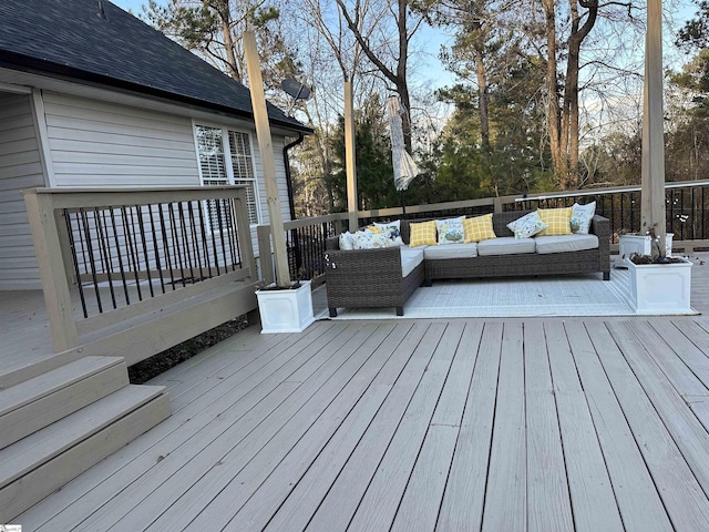 wooden terrace featuring an outdoor living space