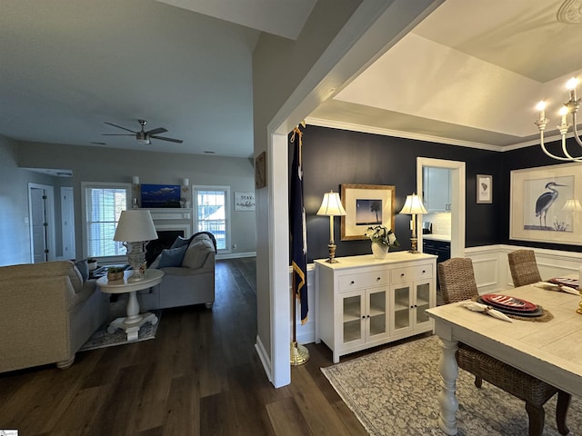 dining room featuring dark hardwood / wood-style floors, ceiling fan, and ornamental molding