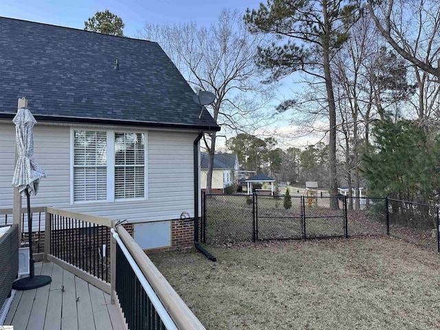 view of property exterior with a wooden deck and a yard