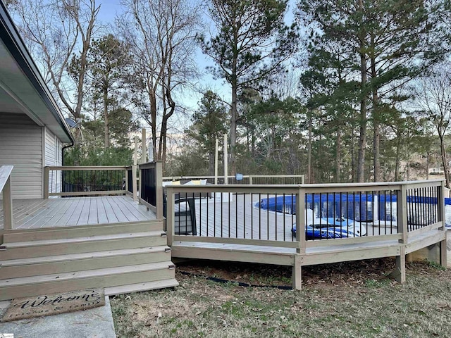 wooden deck featuring a pool