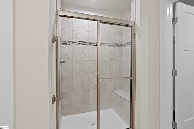 bathroom featuring an enclosed shower