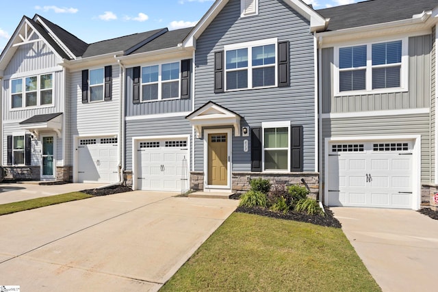 view of front of property with a front lawn and a garage