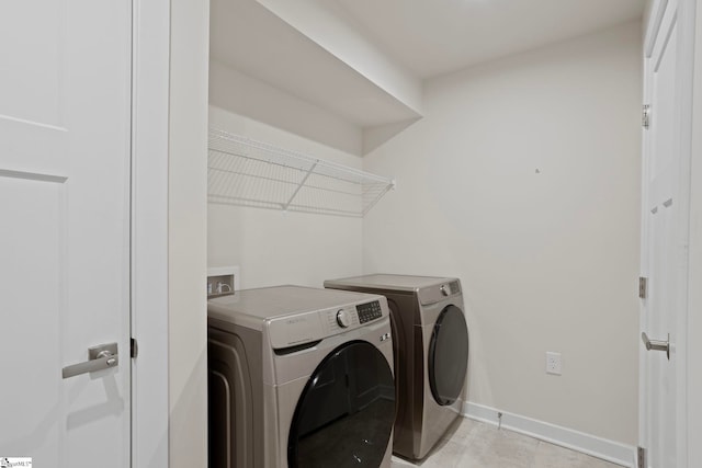 washroom featuring washer and dryer