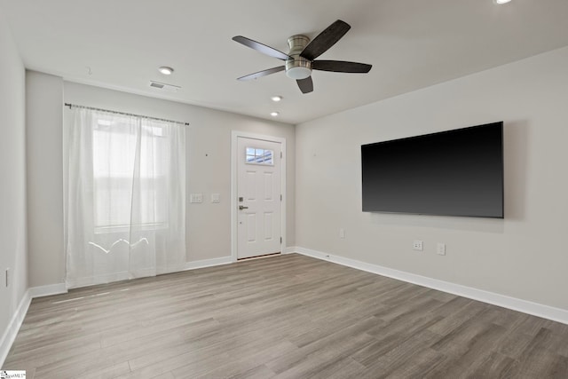 interior space featuring ceiling fan and light hardwood / wood-style flooring