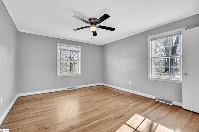 unfurnished room featuring light wood-type flooring, ceiling fan, and ornamental molding