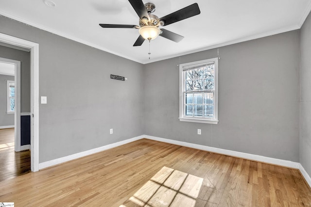 unfurnished room featuring light hardwood / wood-style floors, ceiling fan, and ornamental molding