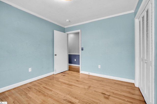 unfurnished bedroom featuring light hardwood / wood-style floors and ornamental molding