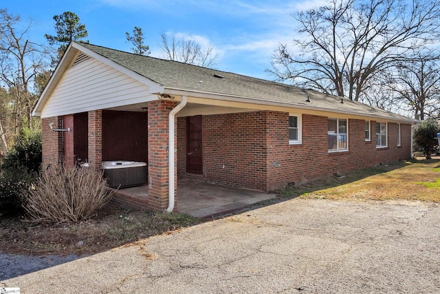 view of home's exterior with a patio area