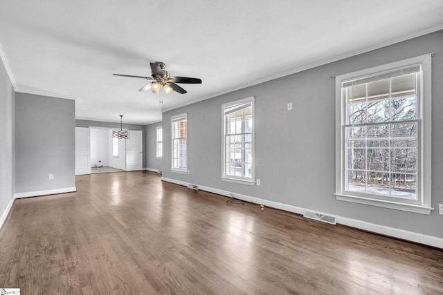 unfurnished living room featuring ceiling fan, crown molding, and hardwood / wood-style flooring