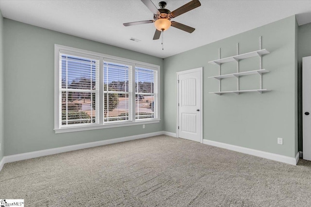 unfurnished bedroom with ceiling fan, carpet floors, and a closet