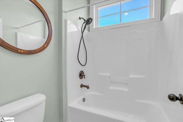 bathroom featuring  shower combination and toilet