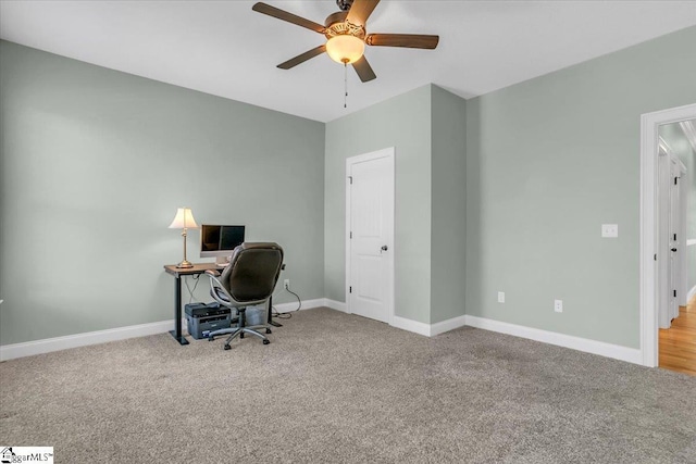 carpeted office with ceiling fan