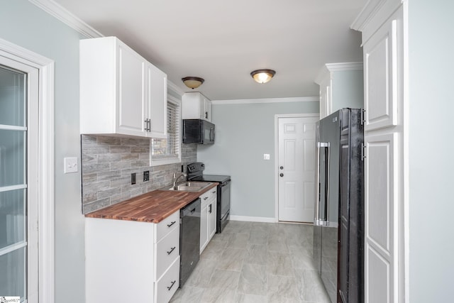 kitchen with ornamental molding, sink, black appliances, white cabinets, and butcher block counters