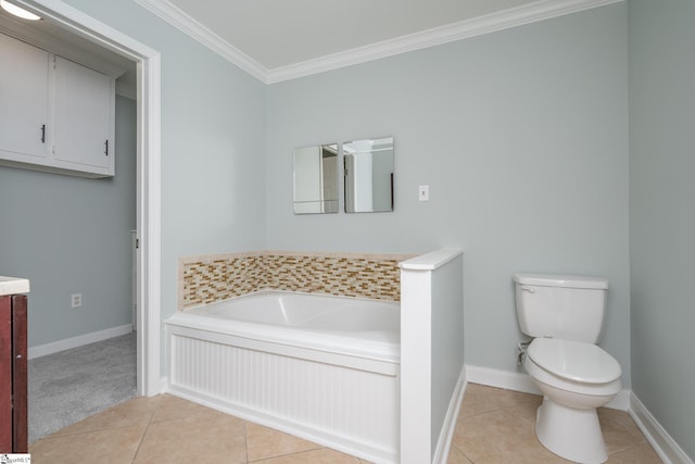 bathroom with tile patterned floors, a tub, vanity, and ornamental molding