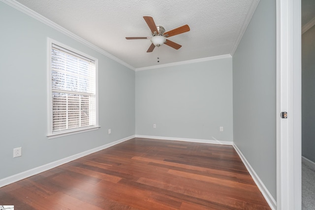 empty room with ceiling fan, dark wood-type flooring, a textured ceiling, and ornamental molding