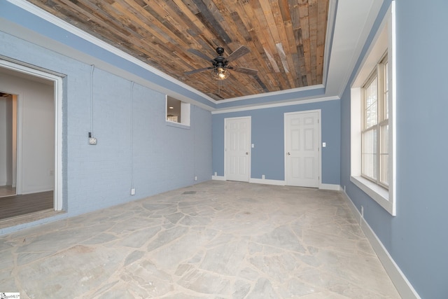 empty room featuring crown molding, ceiling fan, and wooden ceiling