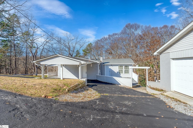 ranch-style house featuring a carport