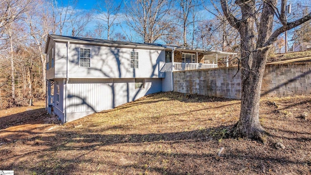 rear view of property featuring a garage