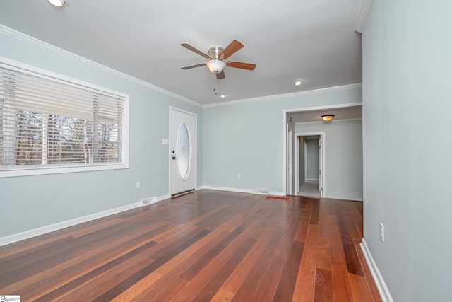 unfurnished living room featuring ceiling fan, crown molding, and dark wood-type flooring