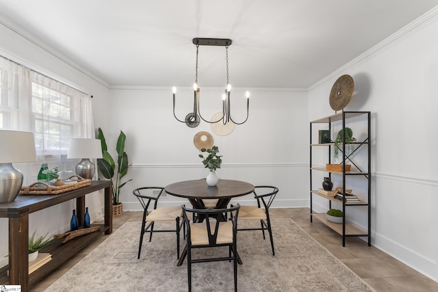 dining area featuring crown molding and a chandelier