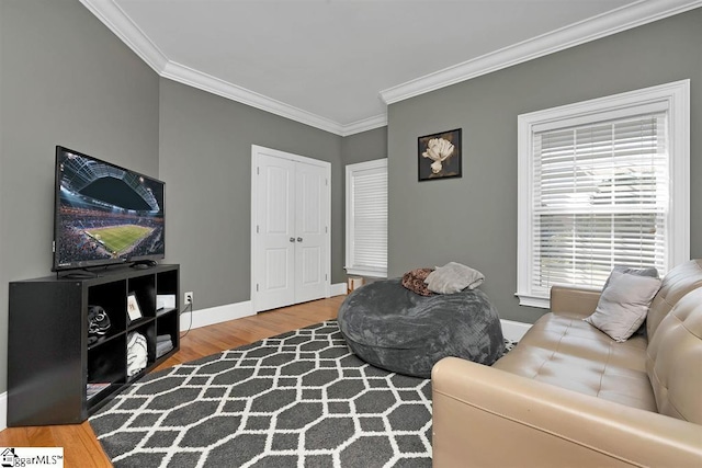 living room featuring hardwood / wood-style floors and ornamental molding