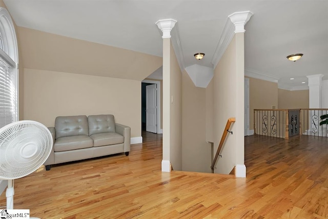 interior space featuring crown molding and light wood-type flooring