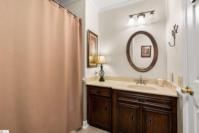 bathroom featuring vanity and crown molding