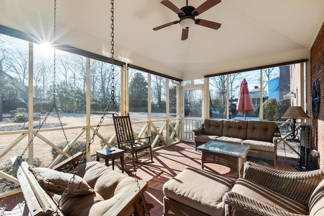 sunroom featuring ceiling fan