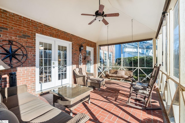 sunroom / solarium with french doors, ceiling fan, and lofted ceiling