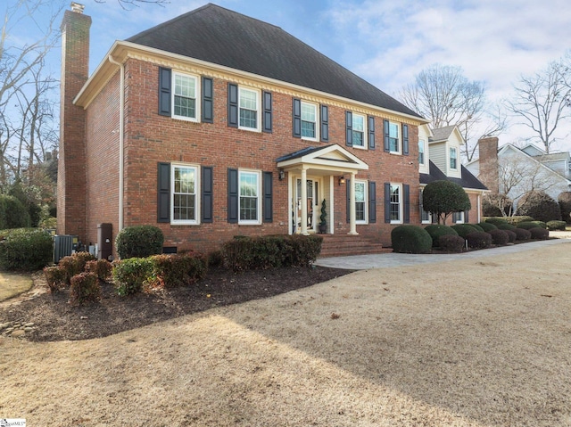 colonial house featuring central AC