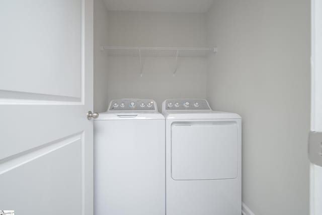 washroom with washer and clothes dryer