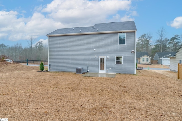 back of house featuring central air condition unit and a patio area