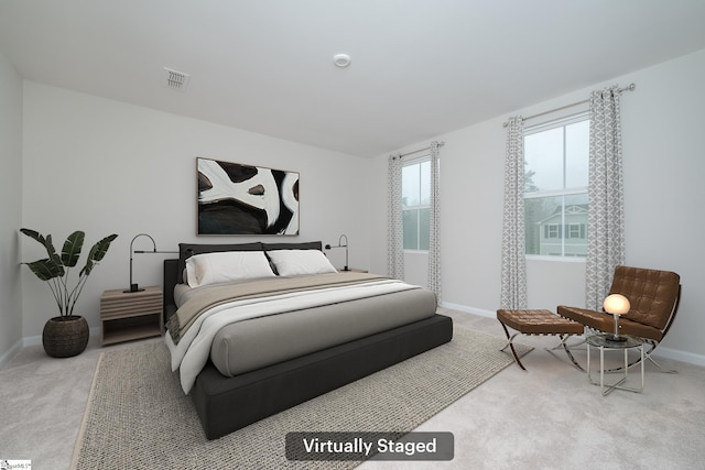 bedroom with light colored carpet