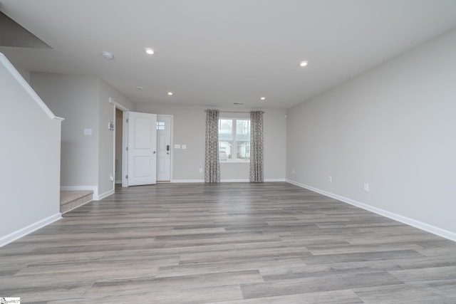 unfurnished living room featuring light hardwood / wood-style flooring