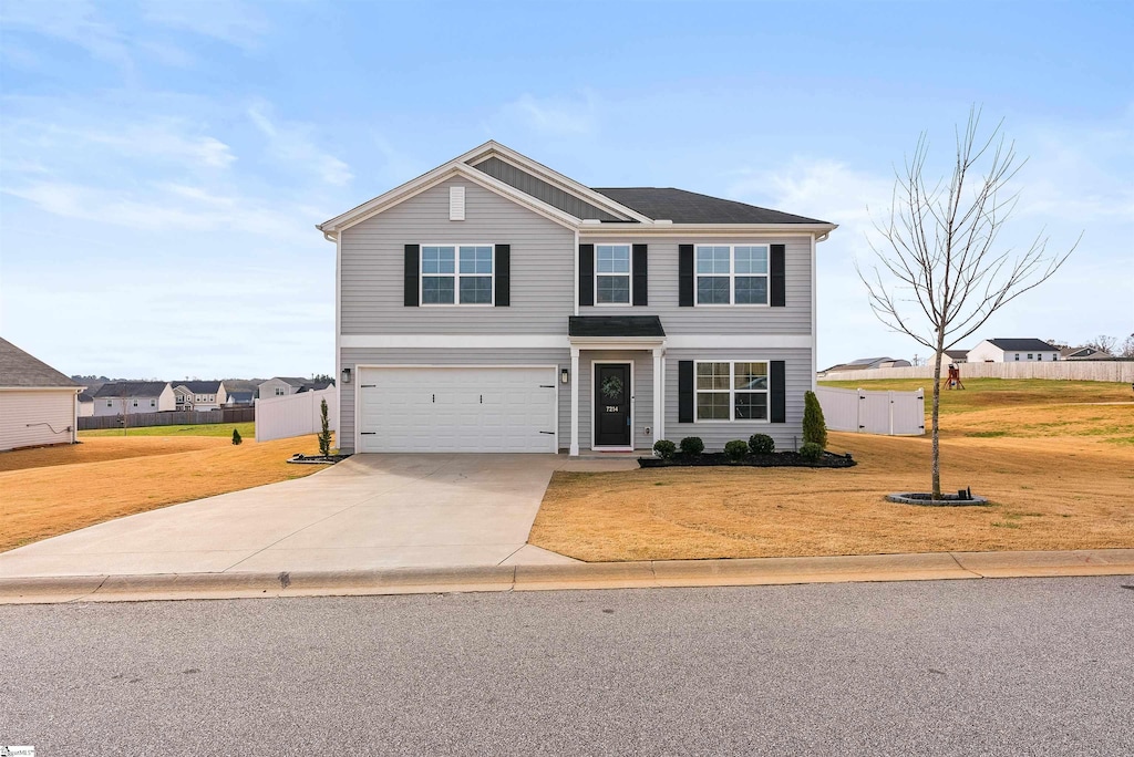 front facade with a front yard and a garage