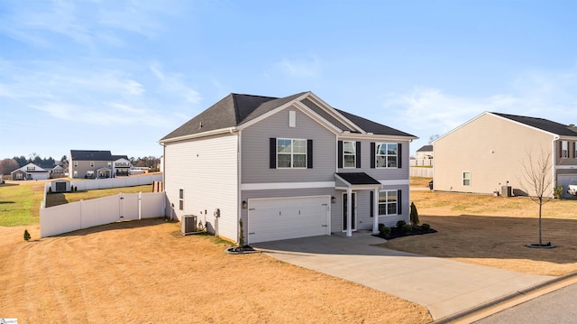 view of front property with cooling unit, a garage, and a front lawn